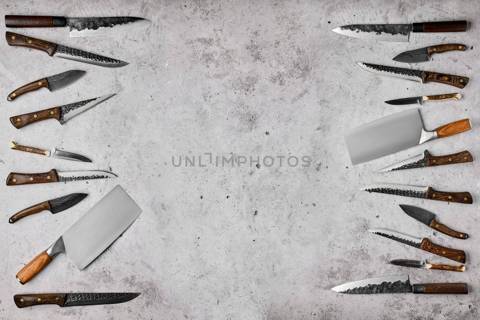 Overhead composition with different kinds of butcher's knives