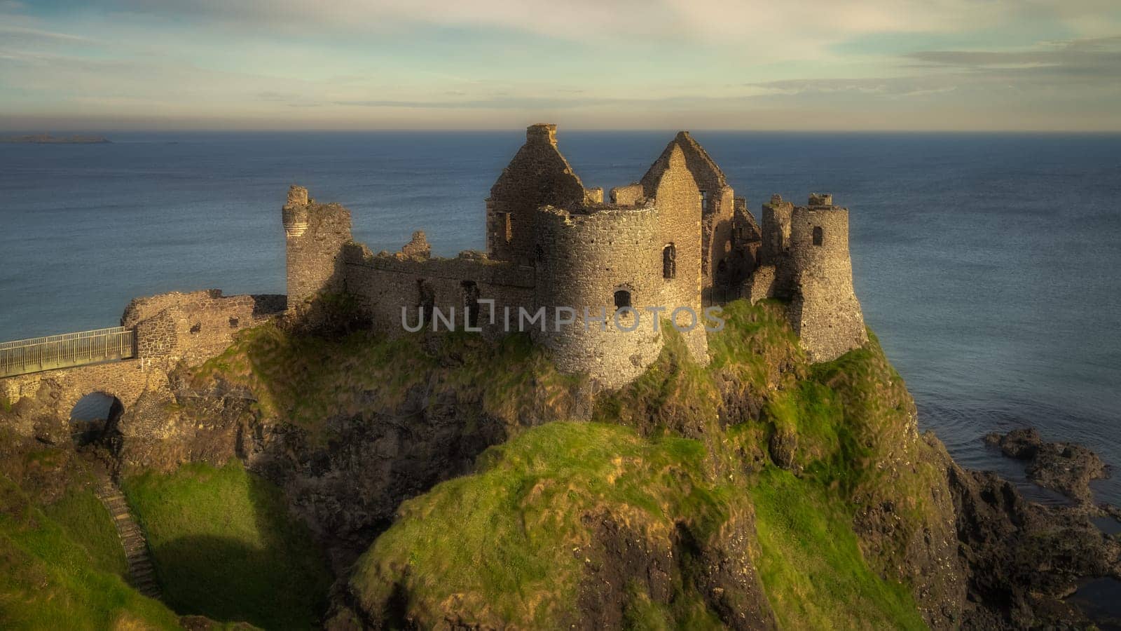 Front view of Dunluce Castle located on the edge of cliff, part of Wild Atlantic Way, Bushmills, Northern Ireland. Filming location of popular TV show