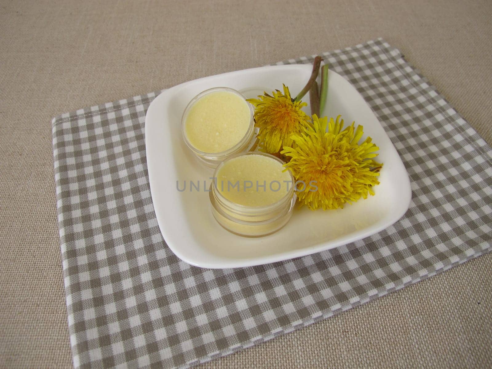 Homemade dandelion ointment, salve with an oil extract of dandelion flowers
