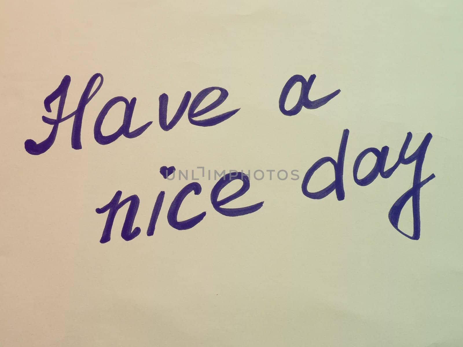 Have a nice day. Phrase or lettering. Black handwritten words. Multicolored background in retro or vintage style. Background burnt out in the light. Good day wishes or goodbye greetings. Postcard.