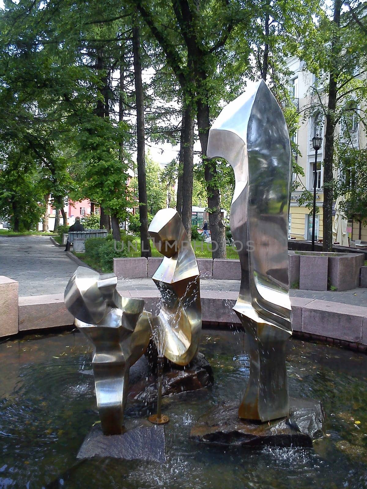 Petrozavodsk, Karelia, Russia, October 14, 2019 A fountain in the city square, depicting three figures - father, mother and child. The sculpture is made of metal