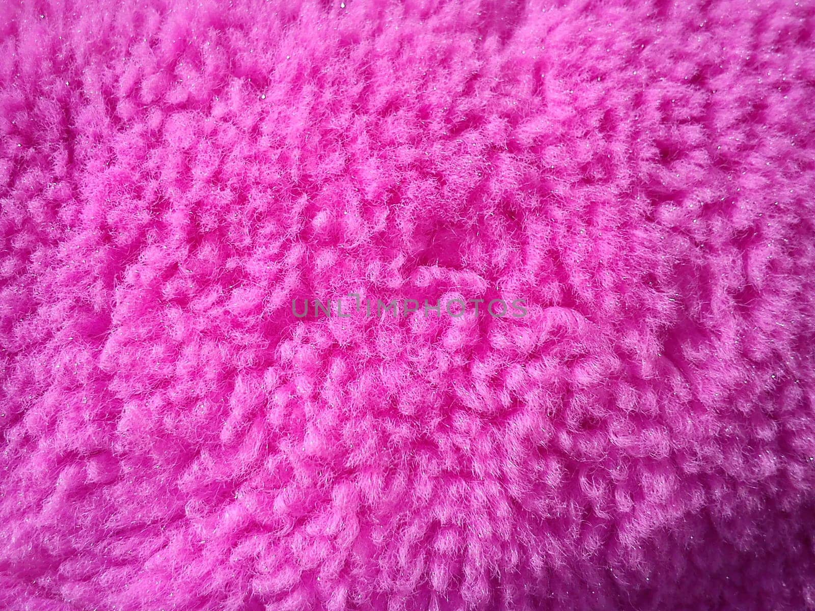 Pink plush material. Wool with spools. Pink Teddy bear