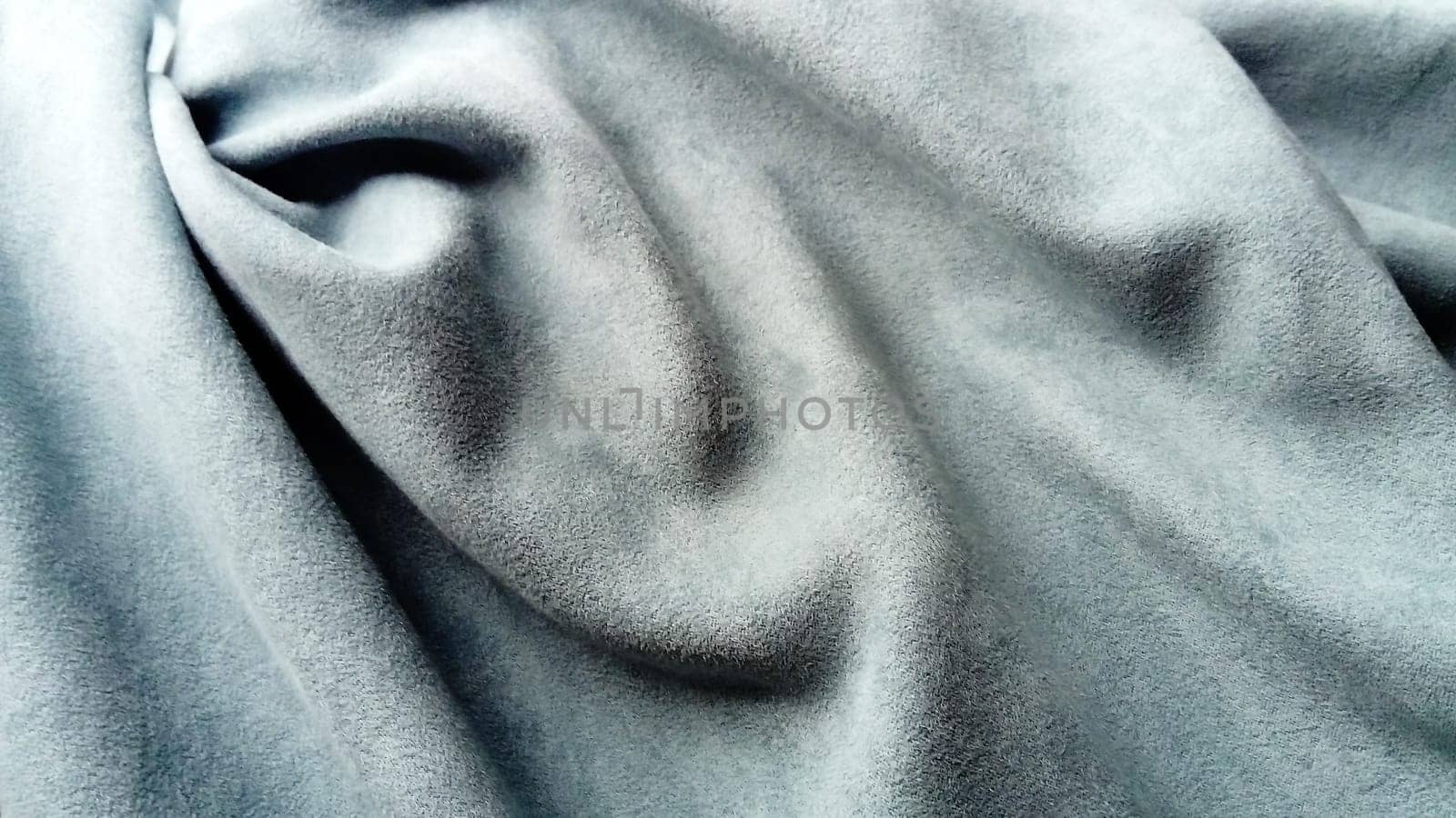Canvas fabric. Grey colour. Blue-gray color. Soft natural light in cloudy weather.