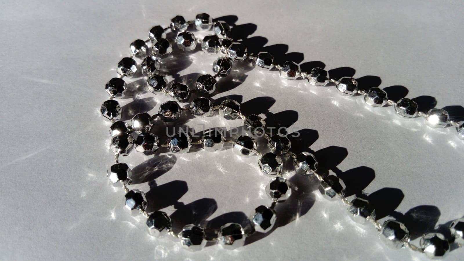 metal bracelet in the form of a thin thread of silver beads