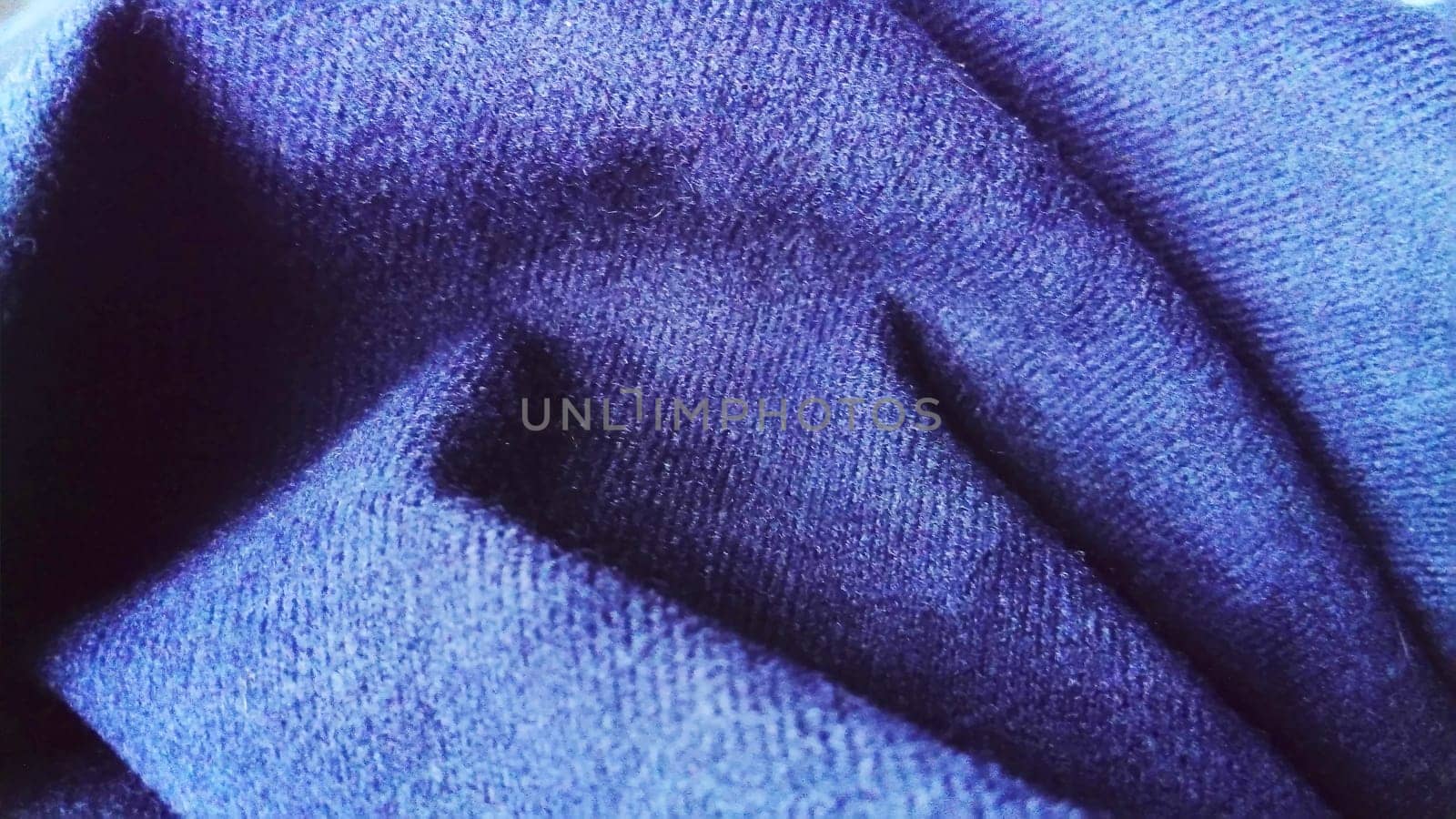 Dark blue fabric that looks like velvet or velveteen. Broken waves