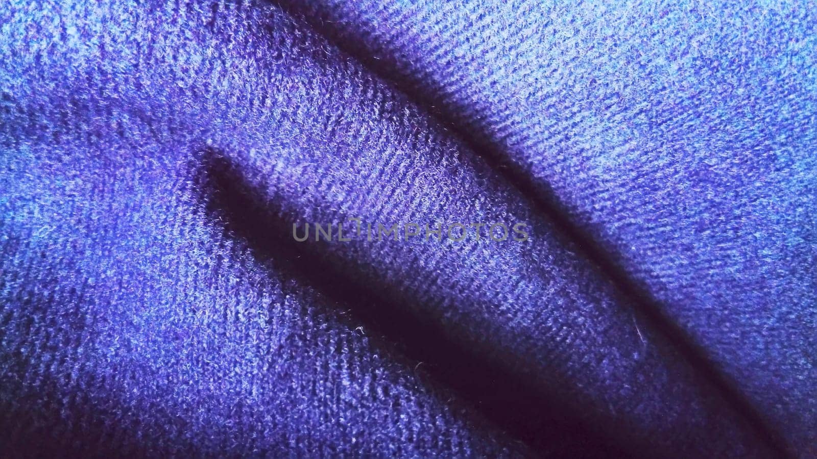Dark blue fabric that looks like velvet or velveteen. Broken waves