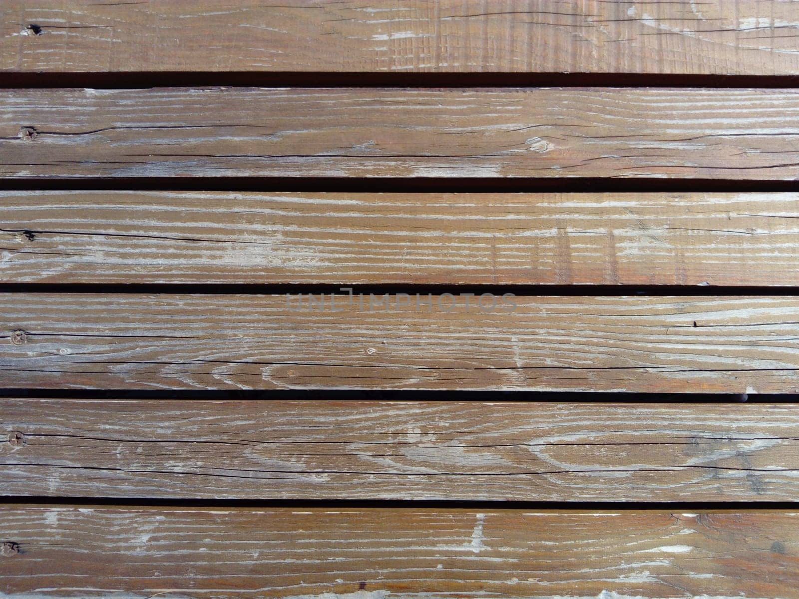 Beautiful smooth unpainted hammered boards. Wooden surface with cracks. A platform or staircase made of wood. Joiner's and carpentry product. The texture of natural material