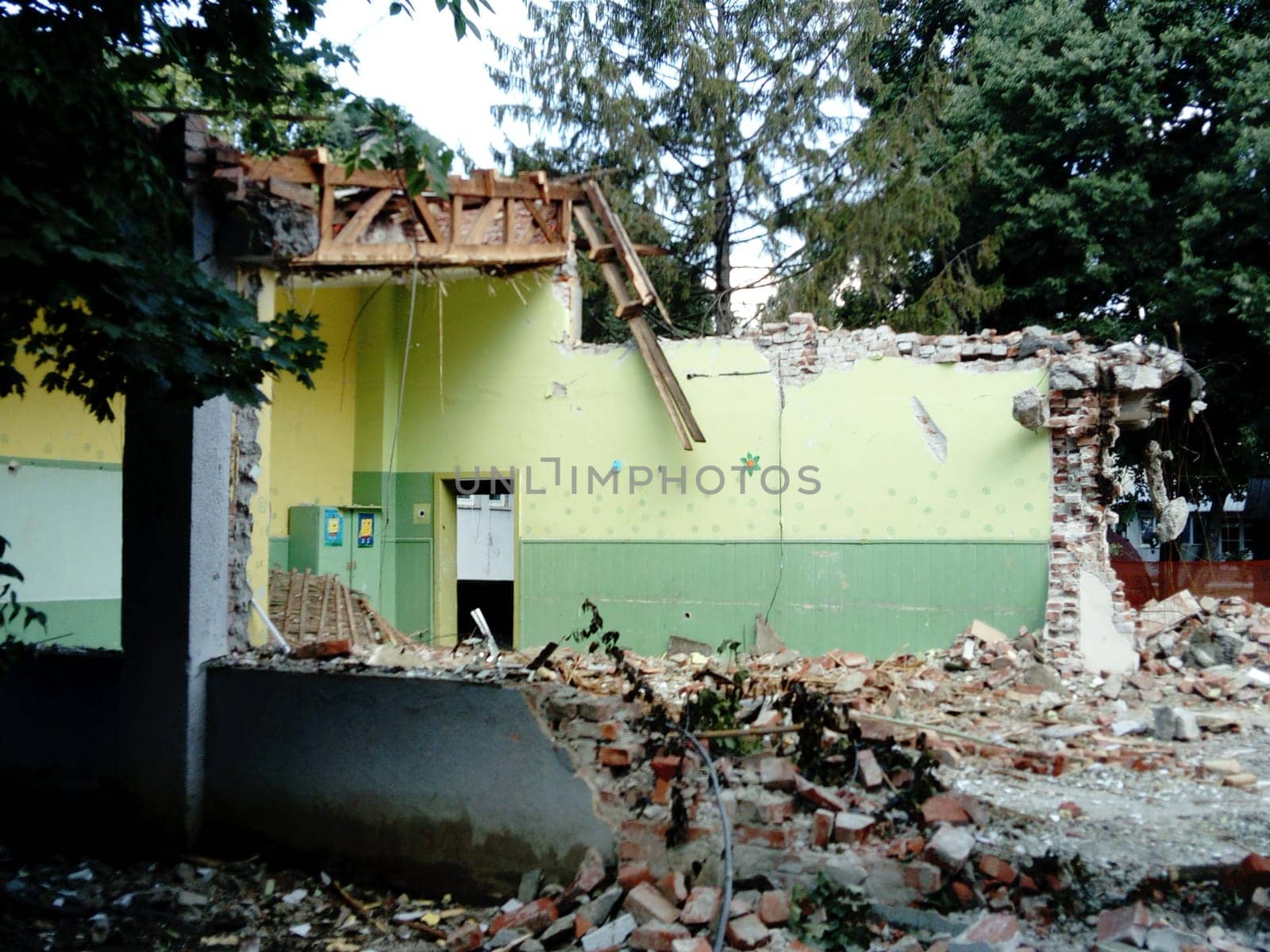 Sremska Mitrovica, Serbia, 13 August 2020. Dismantling and demolition of the old school named after Jovan Popovic. Holes in the walls and ceiling. Ruined classroom.