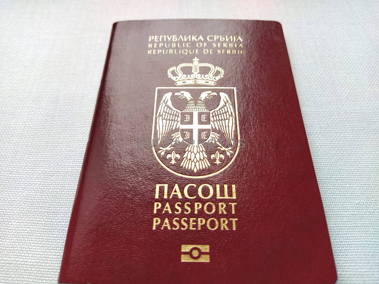 Belgrade, Serbia, November 29, 2020. Serbian passport. New biometric document for border crossing. Official documentation. Shiny letters. Black and white monochrome photography