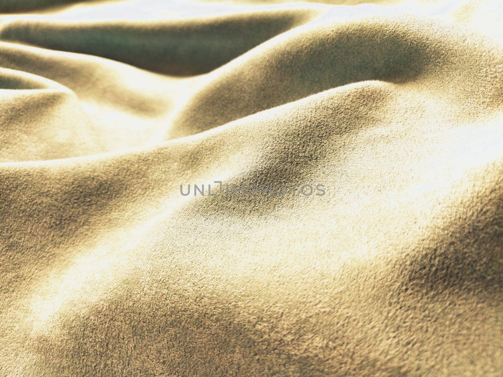 Fabric sheer curtain fabric. Beautiful blue color. Soft velvet with a pile. The curtain material is carelessly folded and wrinkled on a horizontal surface. Fabric sample. Interior design option
