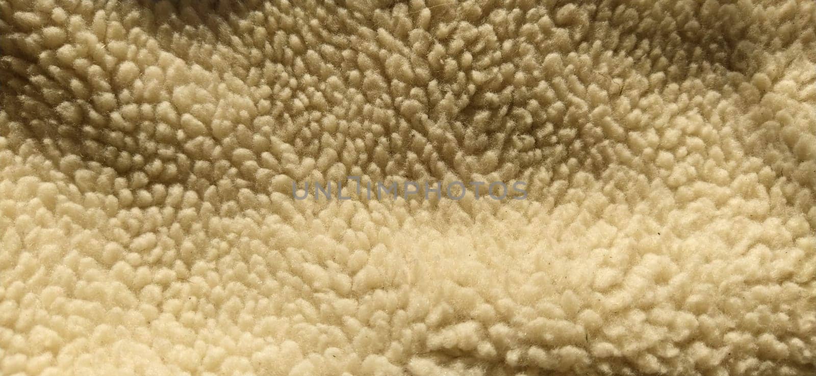 Sheepskin, sheep fur. The inner side of a coat or jacket, trimmed with natural or artificial sheep fur. Karakul as an element of winter outerwear.