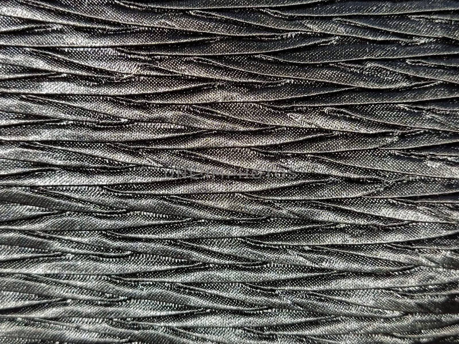 black fabric background.Abstract black woven background. Silk or satin.