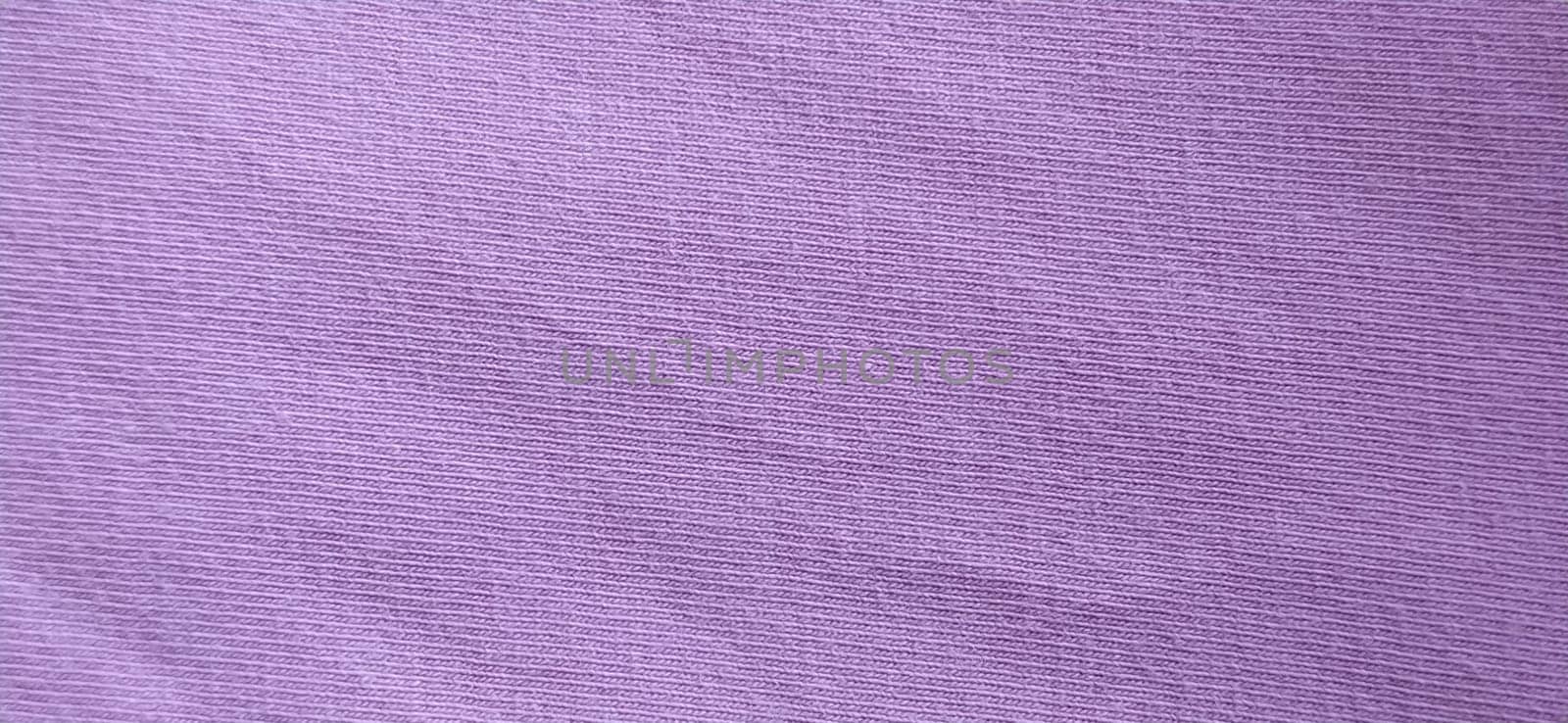 Crumpled pink cotton fabric. Close-up. Fabric texture.