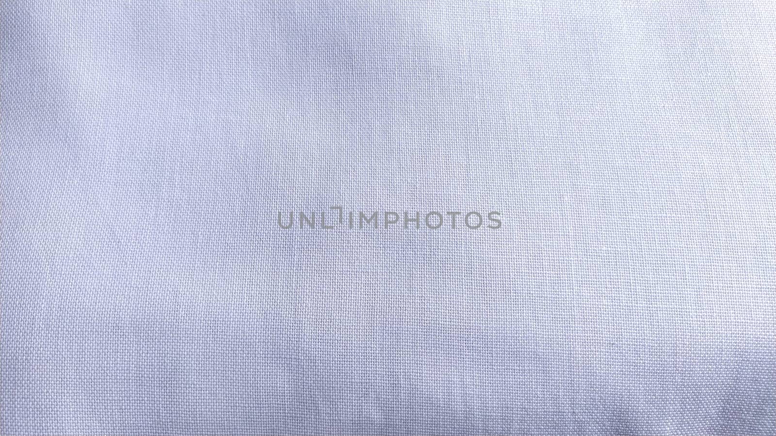 Iron-smoothed white cotton fabric. White background. Tablecloth or sheet