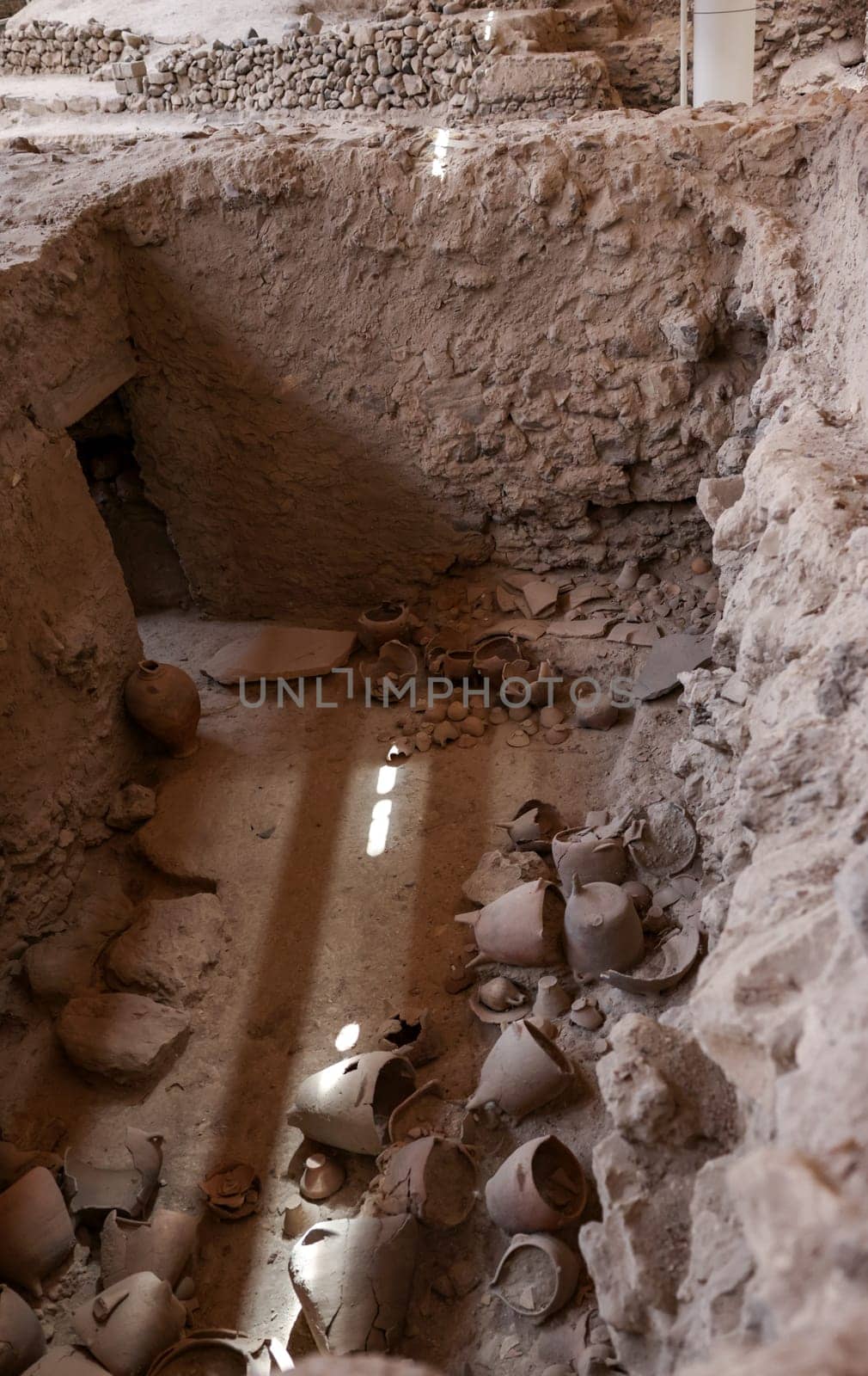 Santorini, Greece - July 01, 2021: Recovered ancient pottery in prehistoric town of Akrotiri, excavation site of a Minoan Bronze Age settlement on the Greek island of Santorini