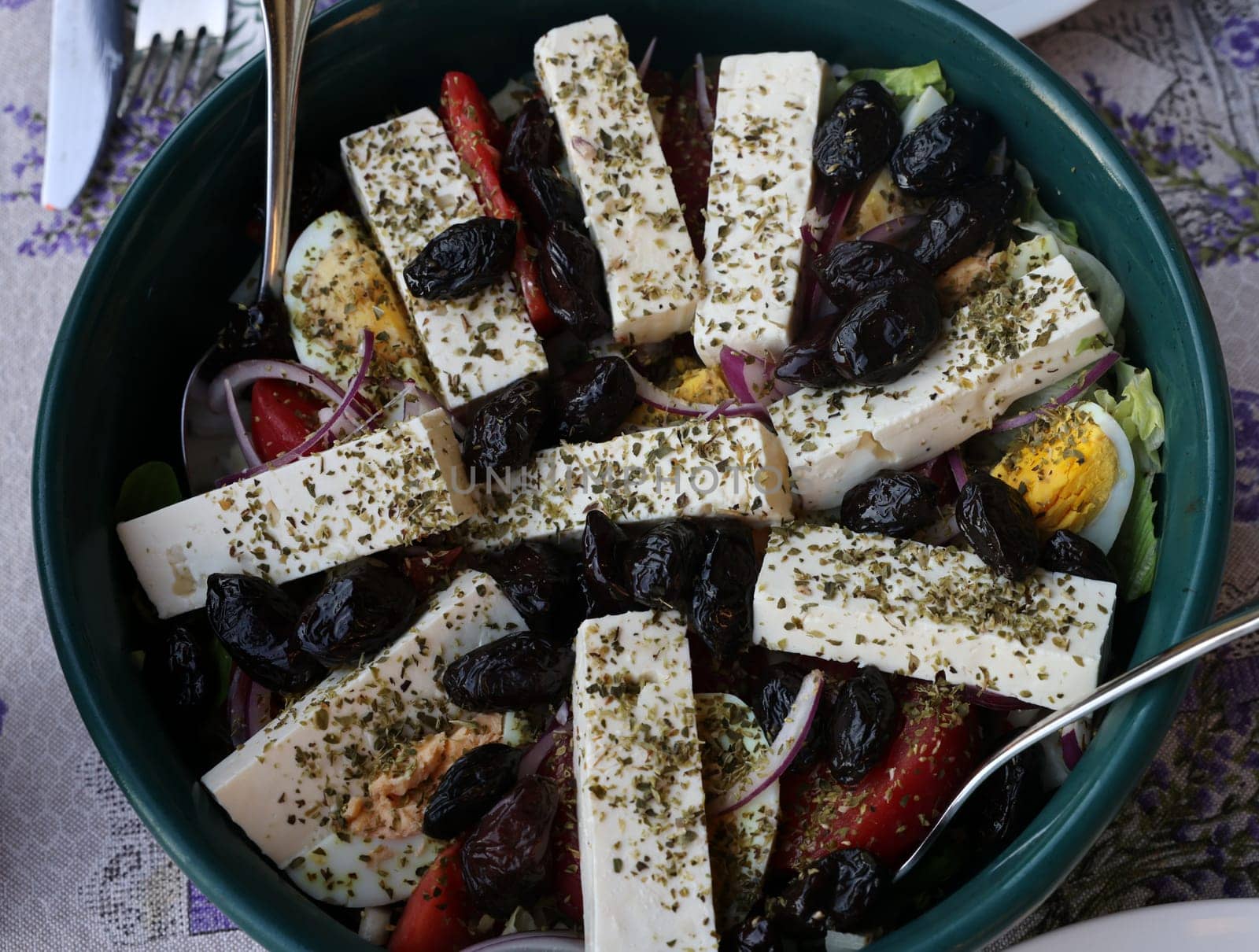 Greek salad with feta cheese and black olives. Typical delicious greek style lunch