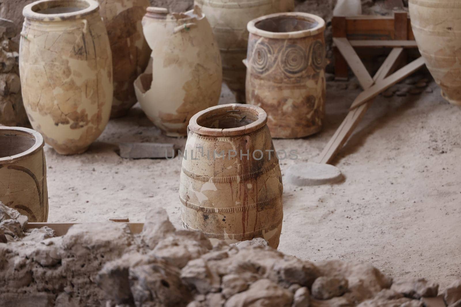 Santorini, Greece - July 01, 2021: Recovered ancient pottery in prehistoric town of Akrotiri, excavation site of a Minoan Bronze Age settlement on the Greek island of Santorini