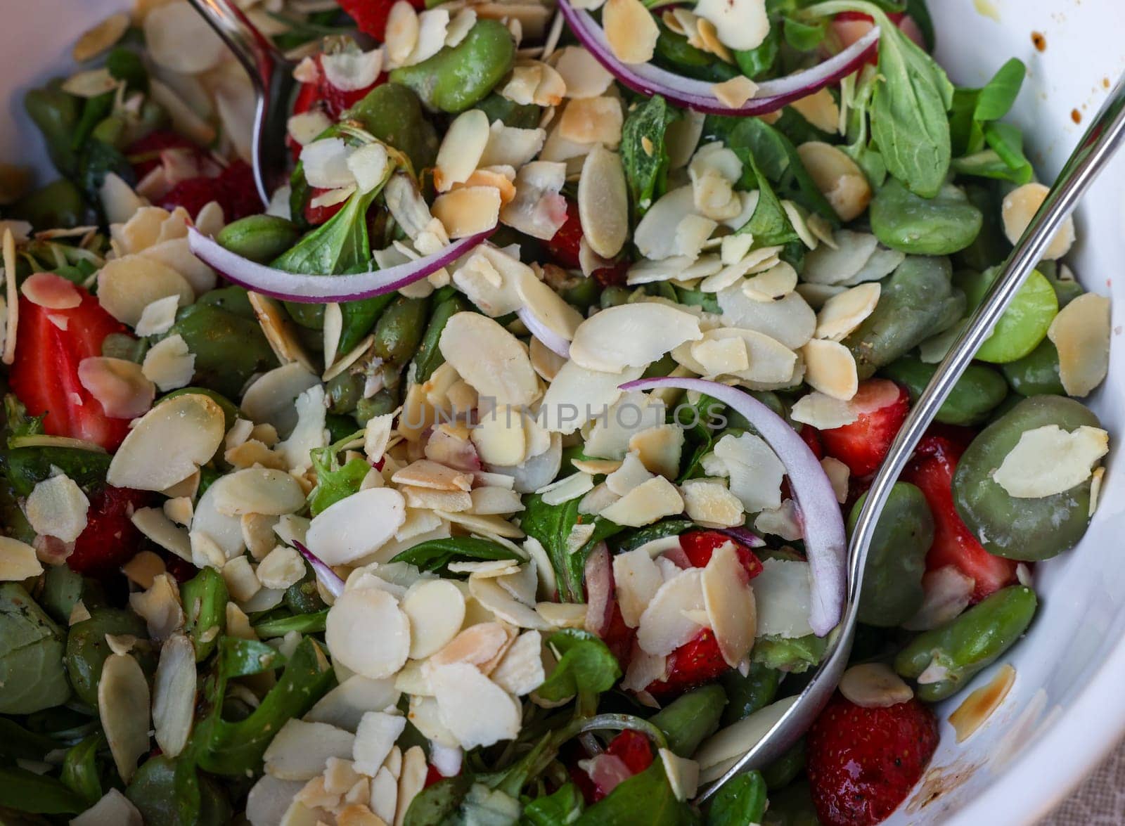 salad with strawberries and broad beans. Delicious dish in a healthy style