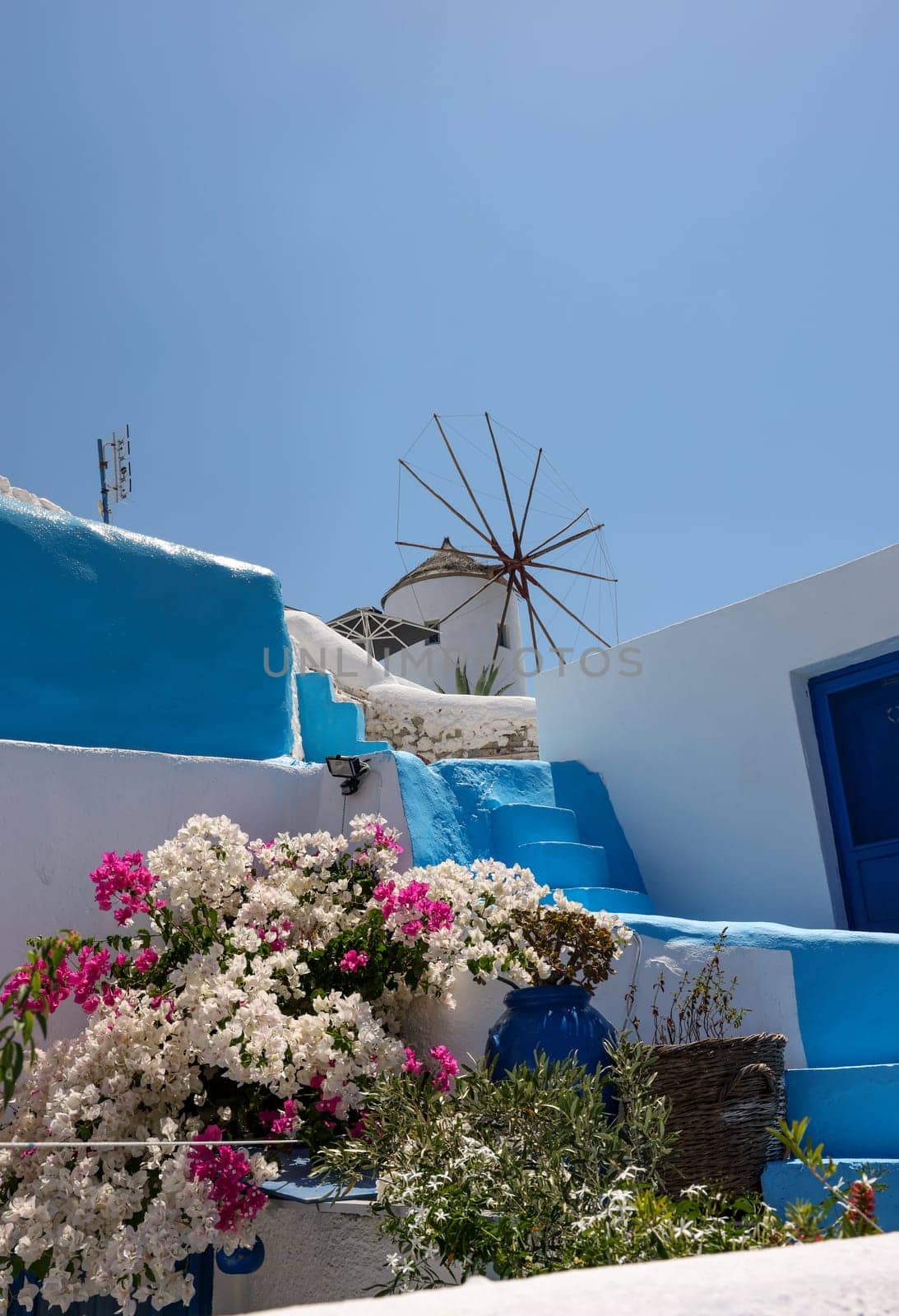 Traditional white windmill in Oia on the island of Santorini. Cyclades, Greece