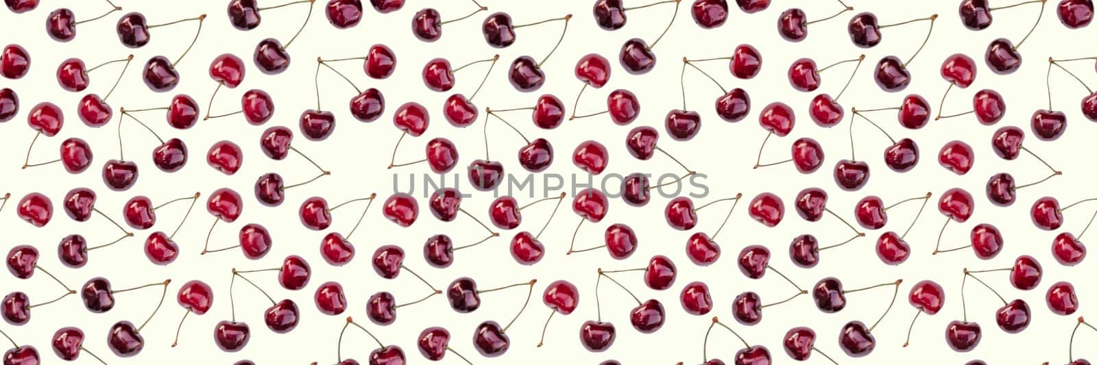 Seamless endless pattern of bright ripe red sweet cherries isolated on white background