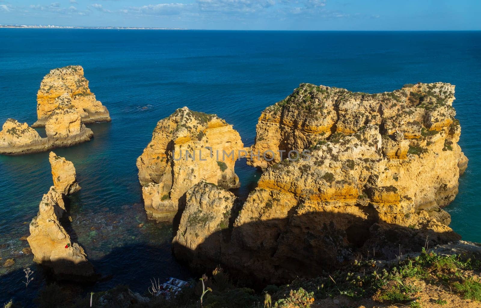 Ponta da Piedade cliffs near Lagos, Portugal. Beautiful seascape with natural rock formations in the Algarve, Portugal