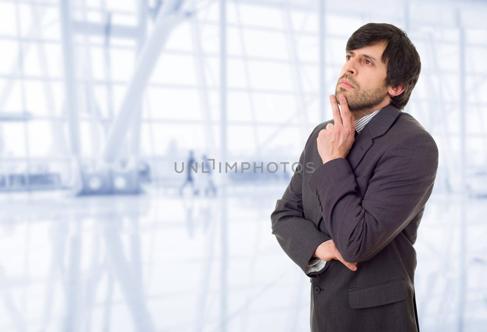 young business man thinking, at the office