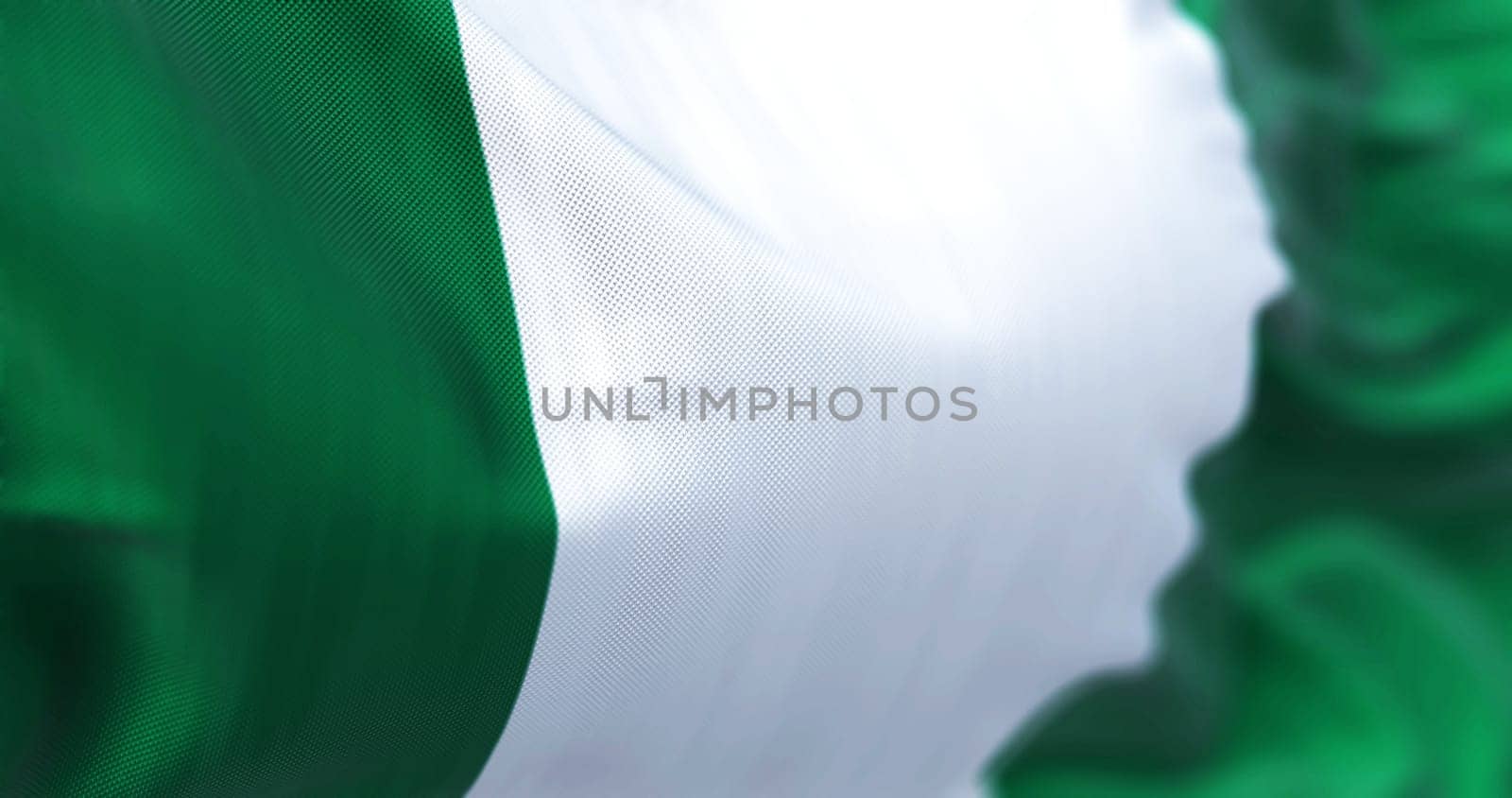 Close-up view of the Nigeria national flag waving. Three equal vertical bands: green, white and green. 3d illustration render. Selective focus. Close-up.