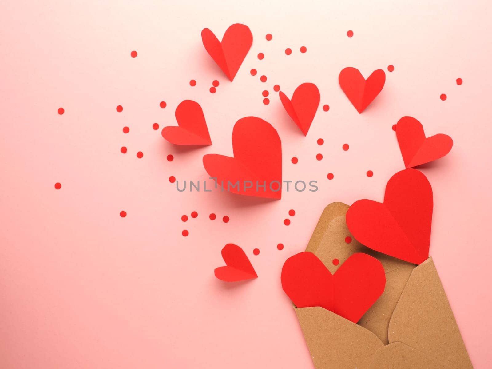 Red heart shapes on a pink background, Wedding or Valentines Day concept, love symbol