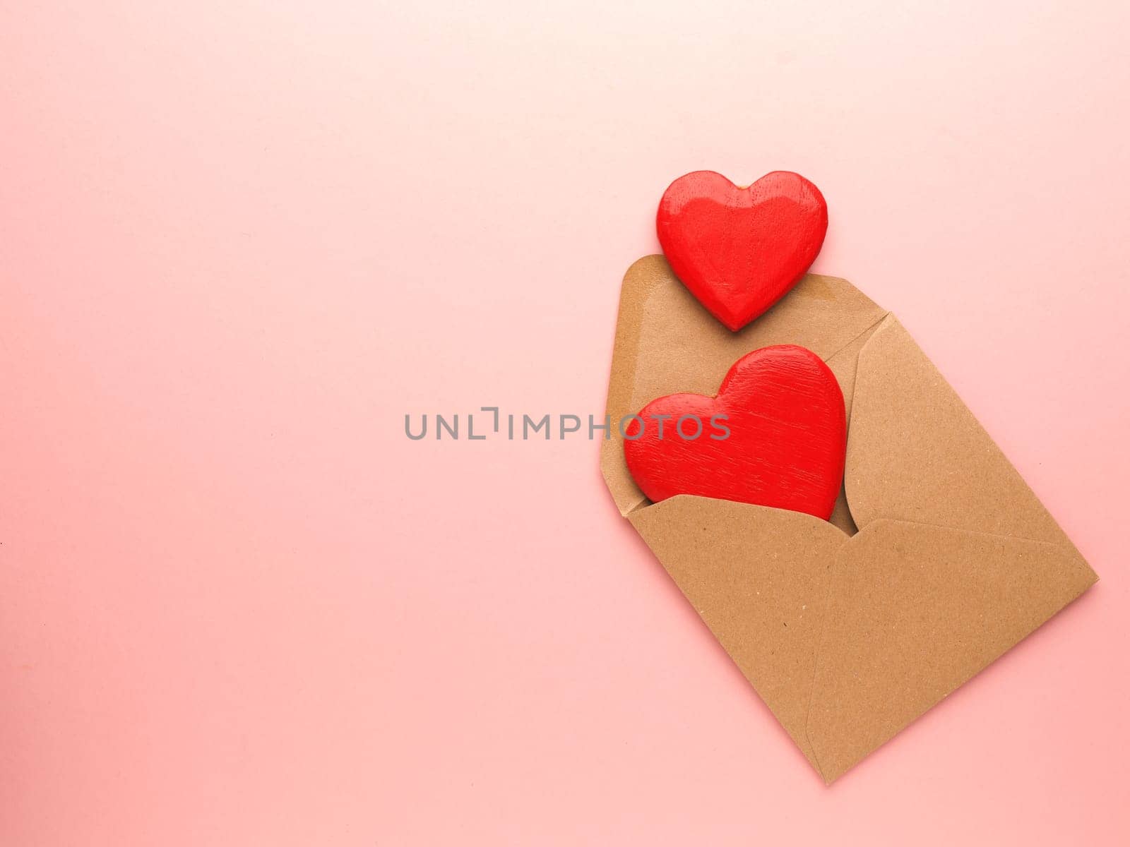 Red heart shapes on a pink background, Wedding or Valentines Day concept, love symbol