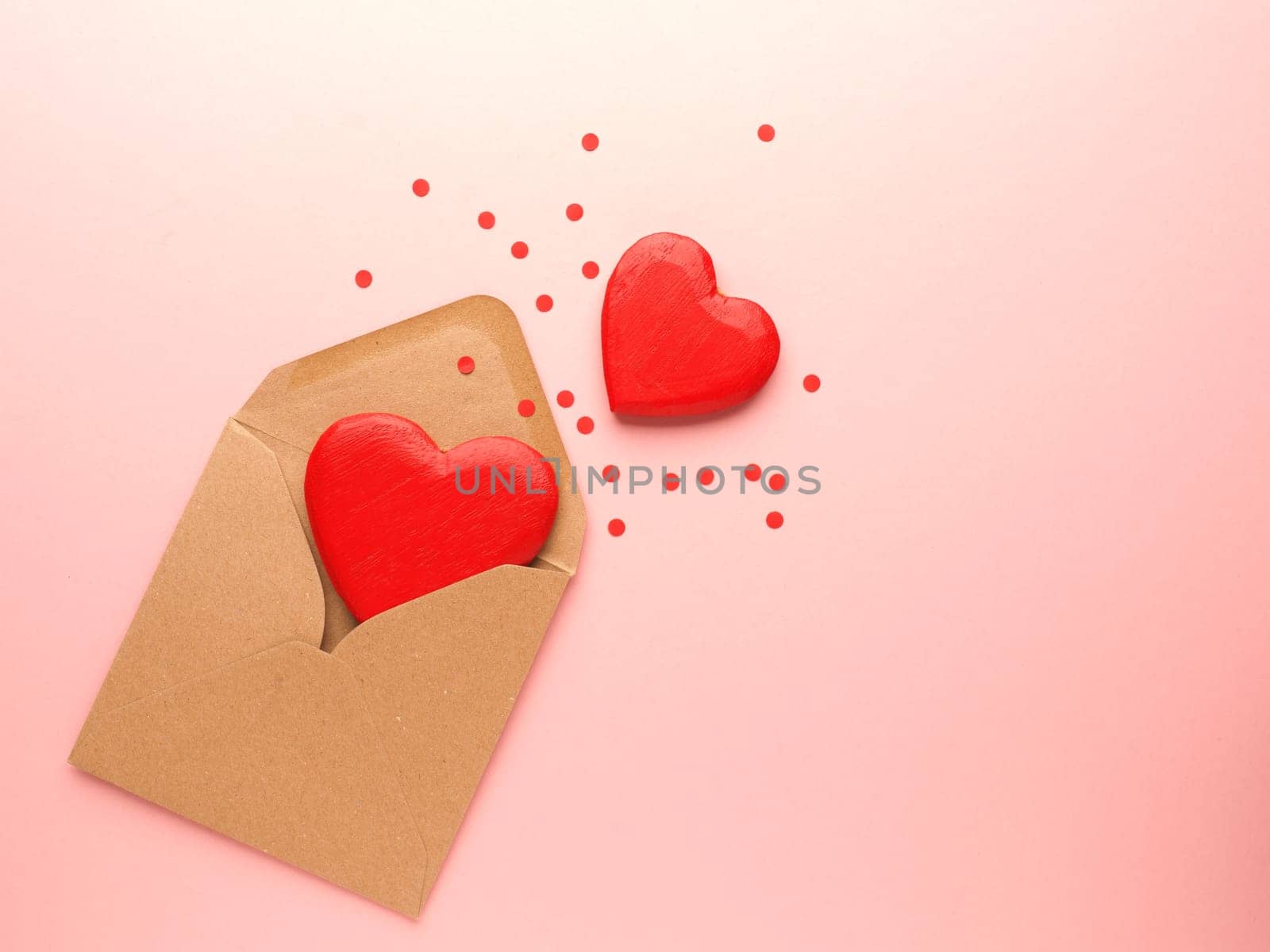 Red heart shapes on a pink background, Wedding or Valentines Day concept, love symbol