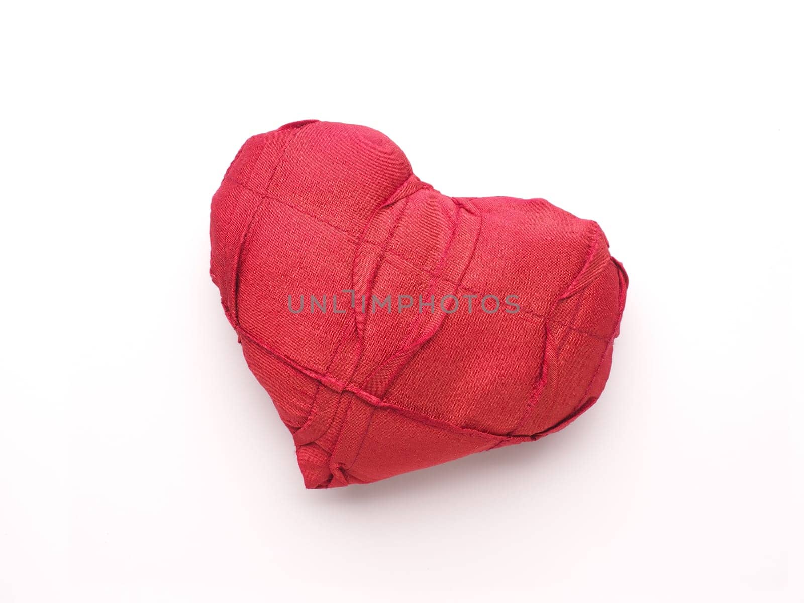 Red fabric heart shape, love symbol, close up studio shot, Valentines Day or wedding object