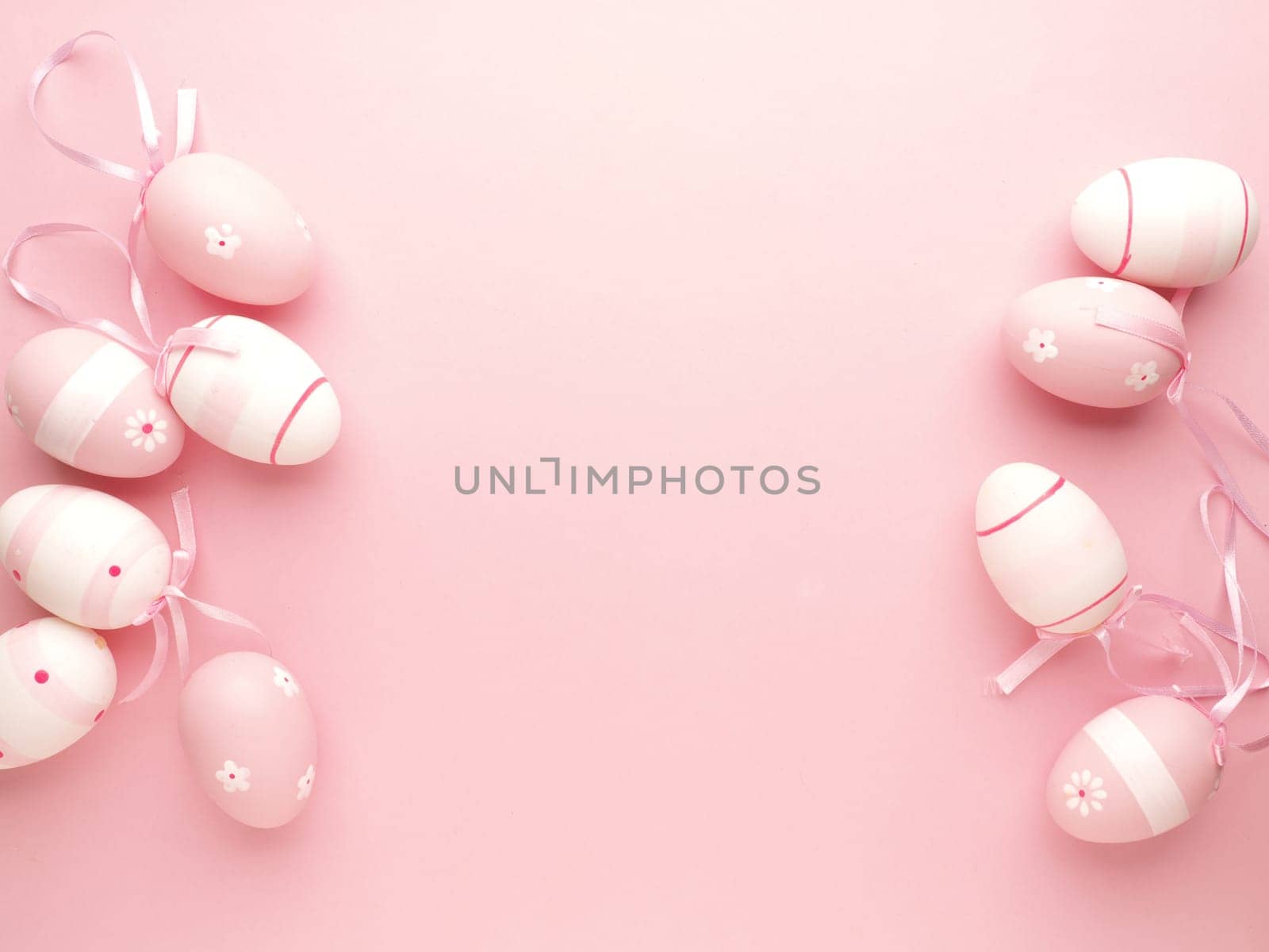 pink Easter eggs on a pink background with space for text