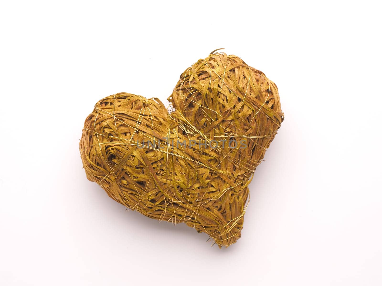 Green straw heart shape, love symbol, close up studio shot, Valentines Day or wedding object