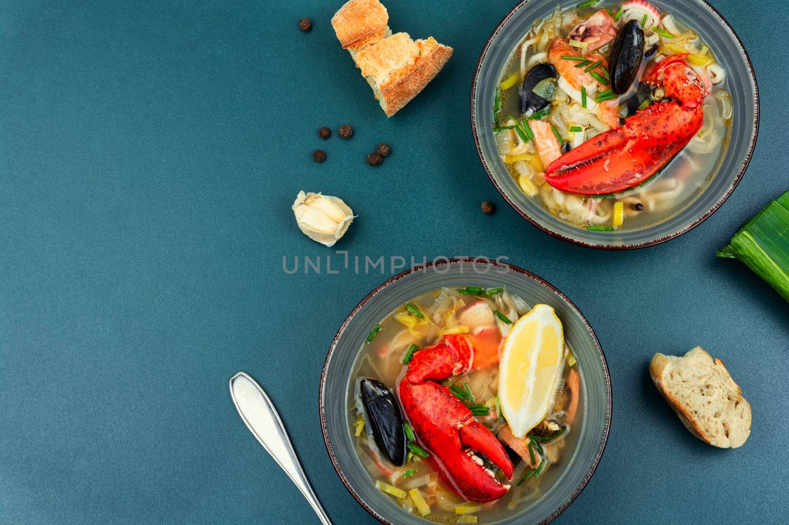 Tasty soup with lobster, mussels, shrimps and fish. Seafood soup. Copy space