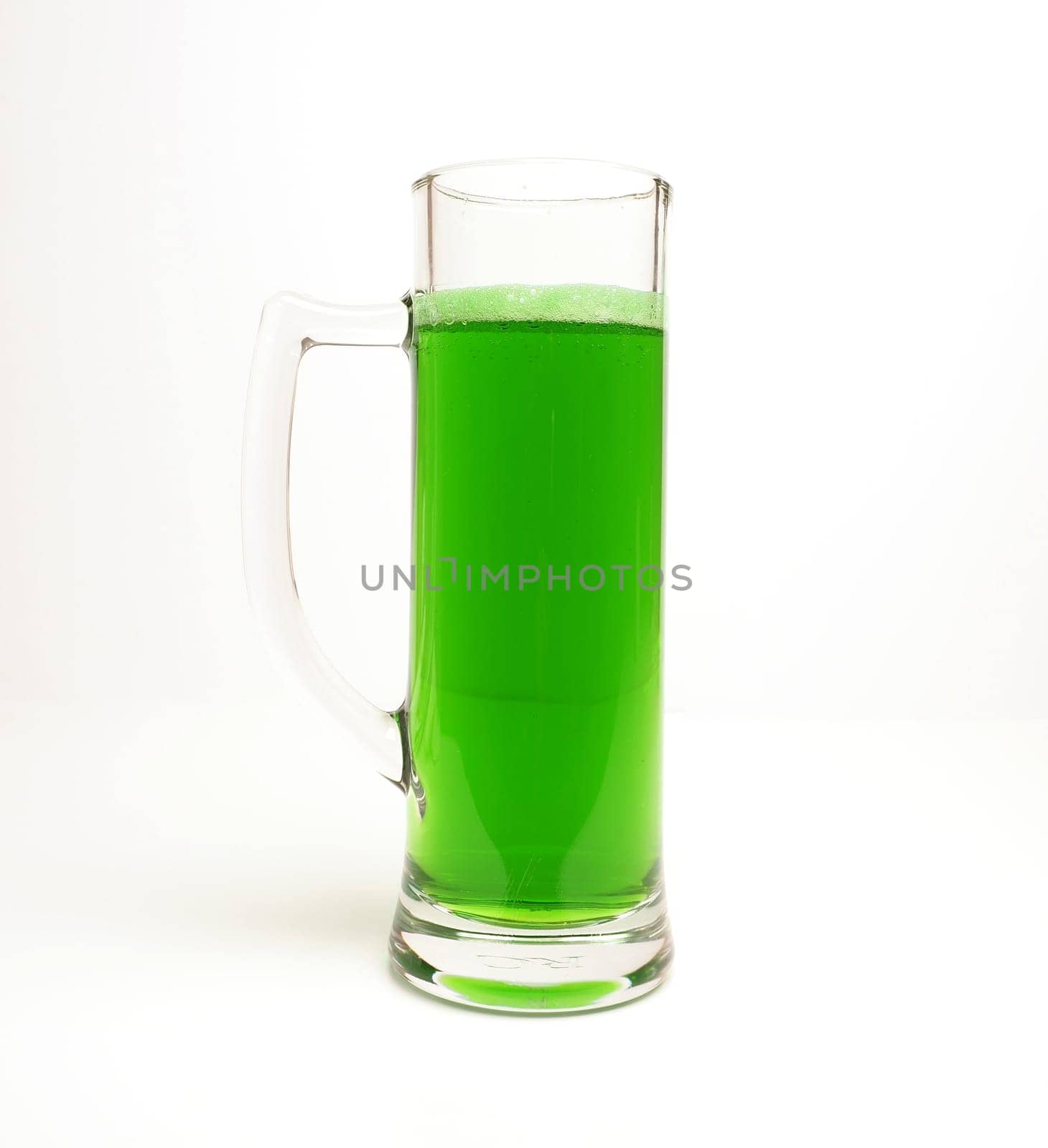 Glass of green beer on a bright background , Happy St Patricks Day