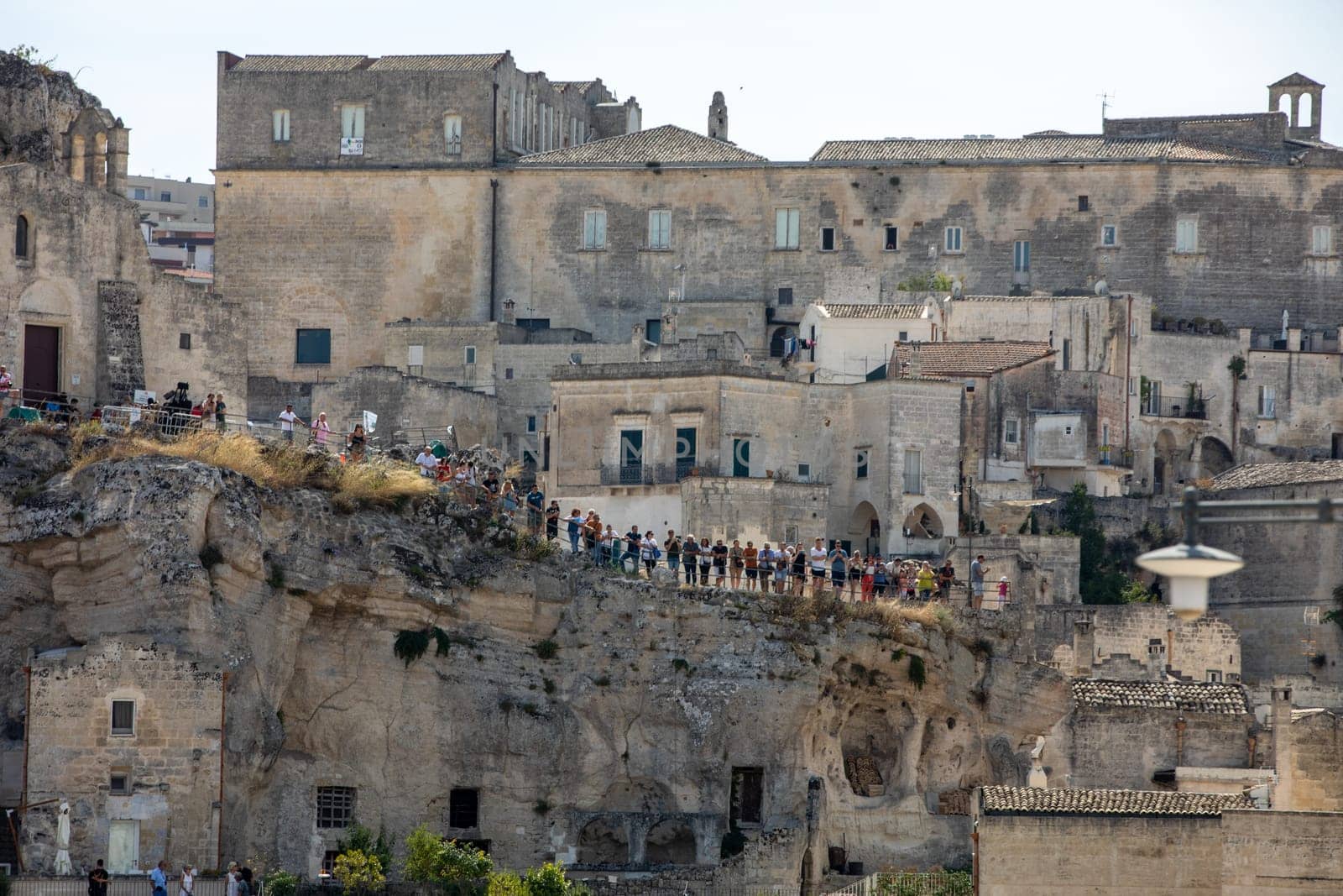 Matera, Italy - September 15, 2019: Tourists in the Sassi di Matera a historic district in the city of Matera. Basilicata. Italy
