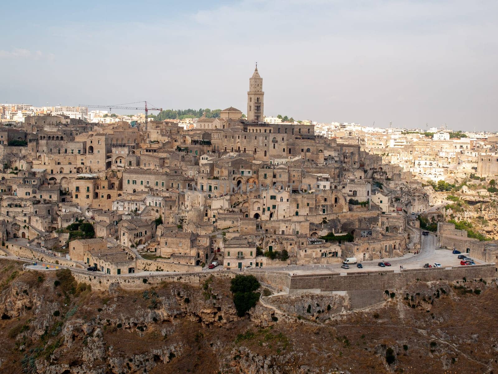 Panoramic view of Sassi di Matera a historic district in the city of Matera, well-known for their ancient cave dwellings from the Belvedere di Murgia Timone,  Basilicata, Italy