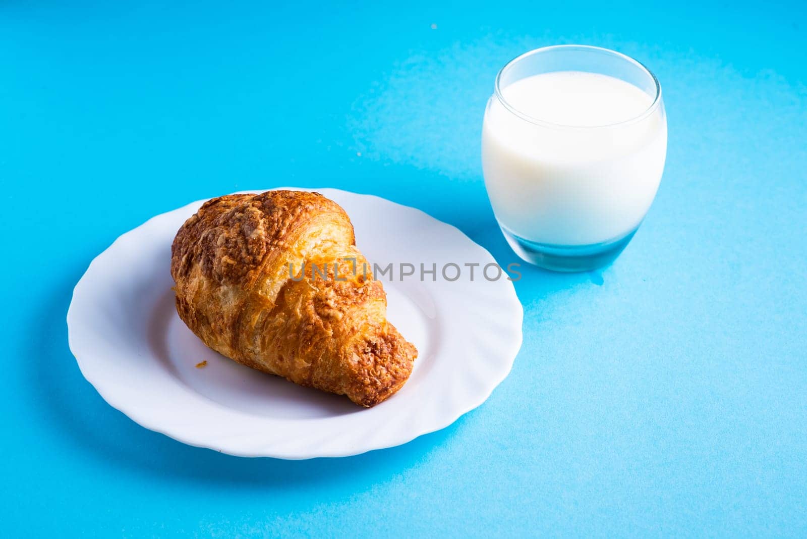 Wheat bread breakfast and milk in a morning, croissant, plate