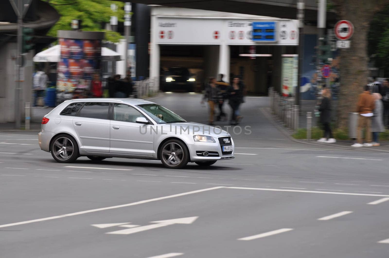 Silver Audi A3 8P while driving on intersection in Bochum, Germany.