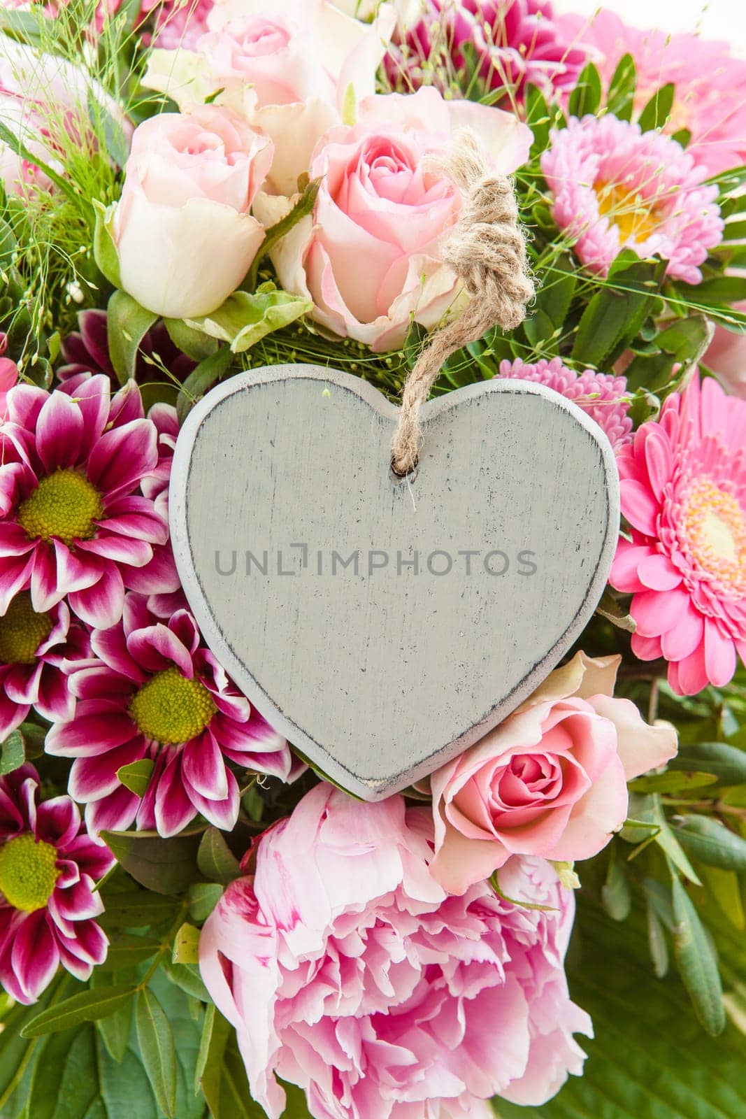 Colorful summer flowers in a bouquet with gift-awepers