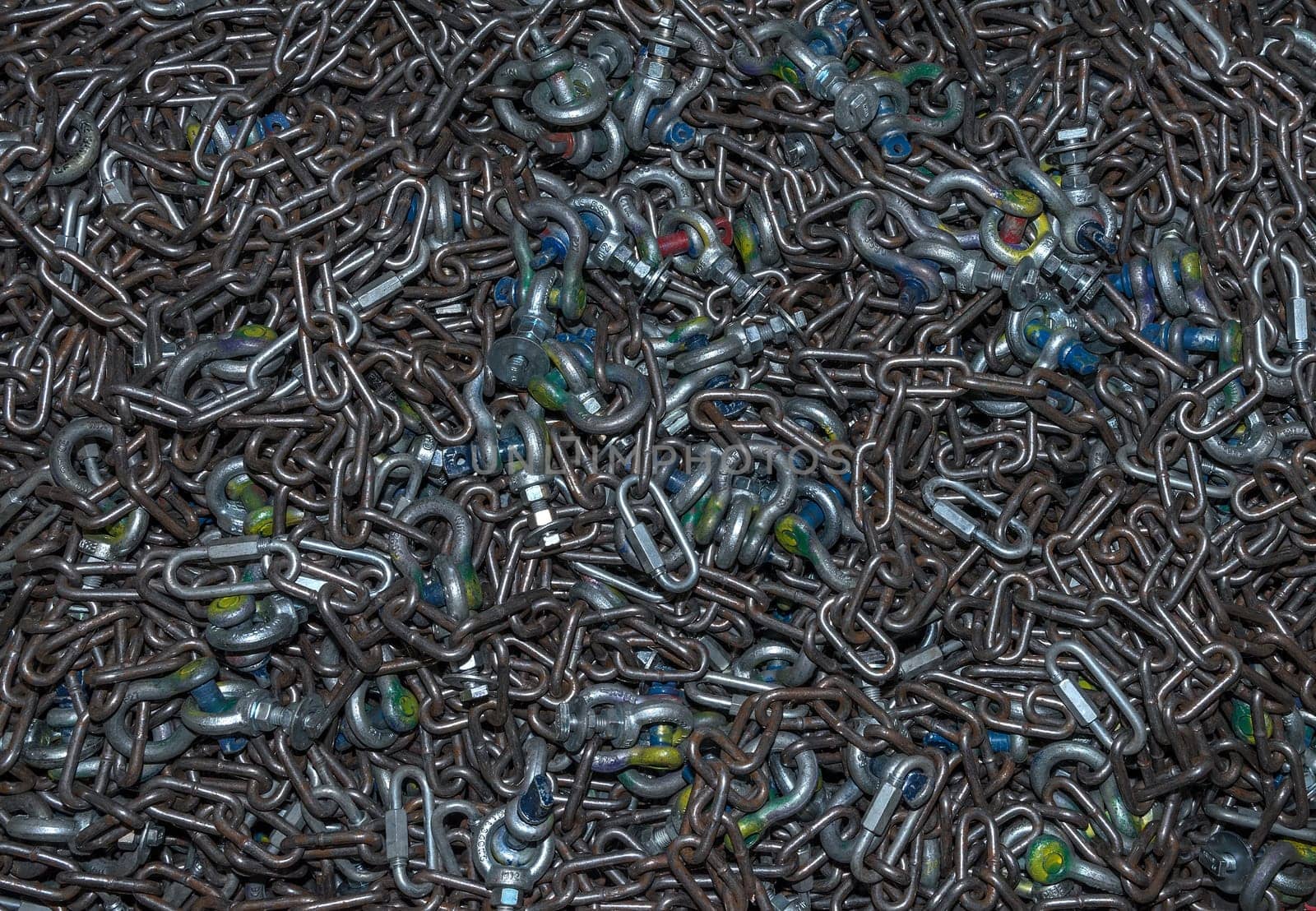 many different types of used iron shackles