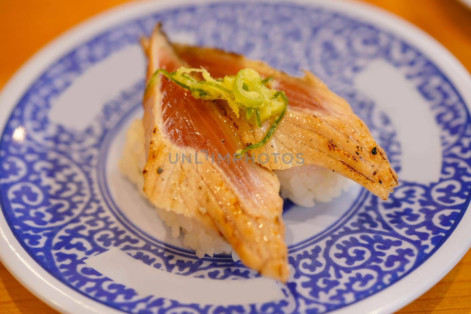 Close-up on Japanese salmon sushi grilled with soya sauce