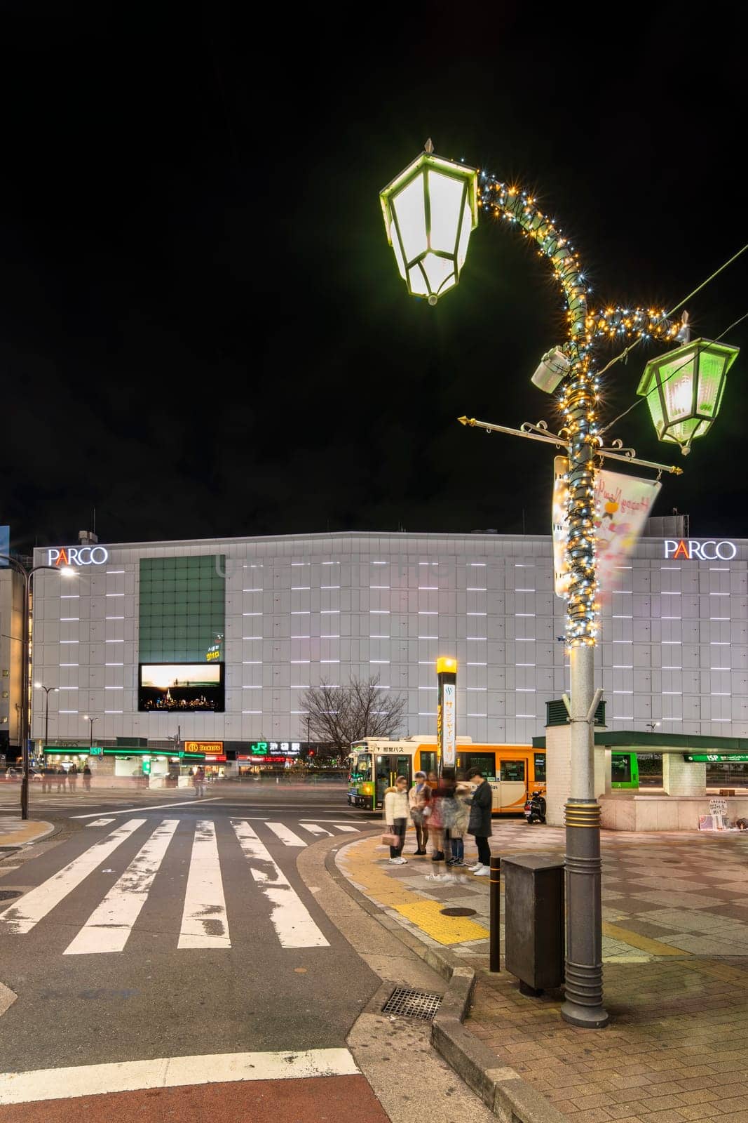 ikebukuro, japan - december 31 2019: Night view of the Sunshine Street at the east exit of Ikebukuro train station with restaurants and shops illuminated for christmas and new year celebrations.