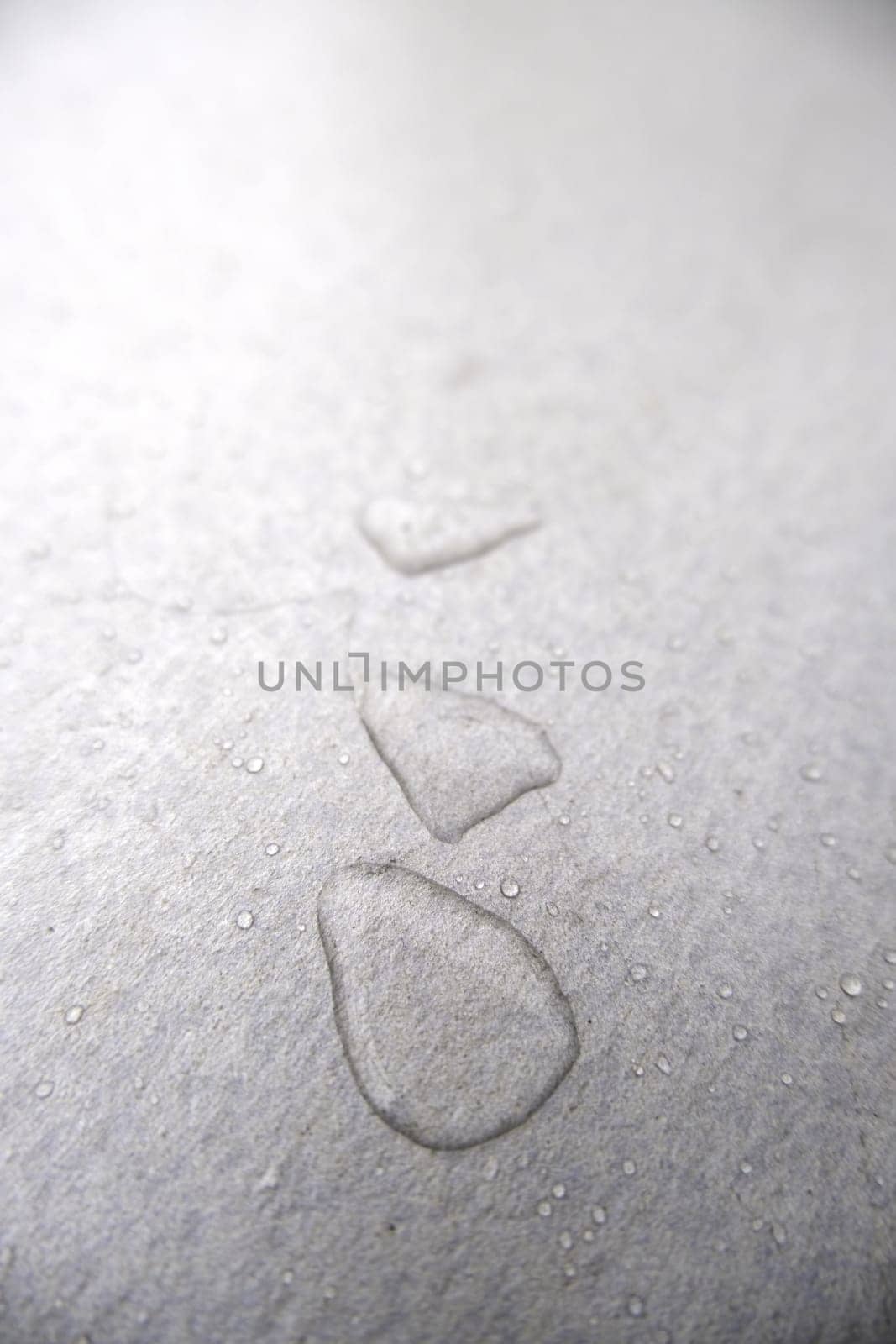 Detail of rainwater on a metal surface outdoors
