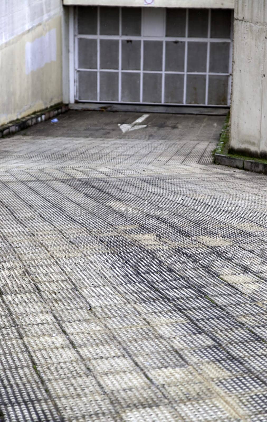 Detail of the entrance slope to a garage in the city