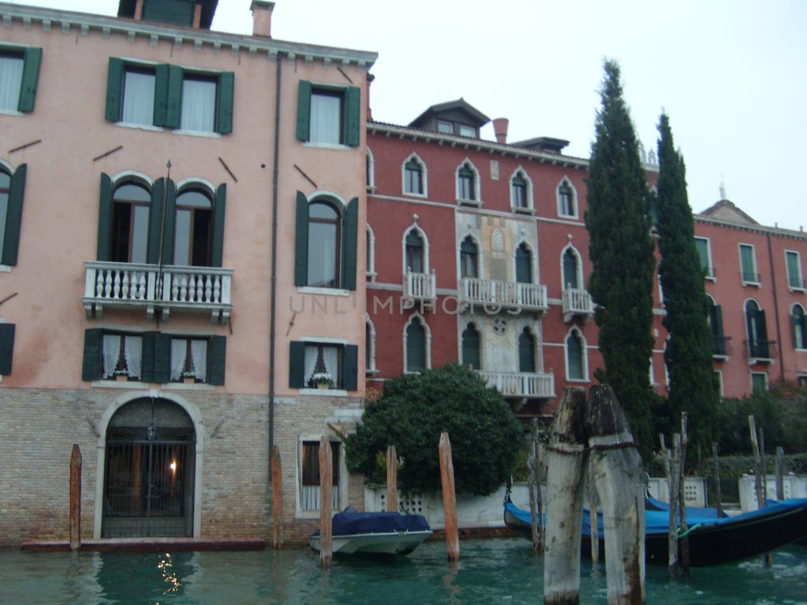 Venice, Italy, July 22, 2007. Venetian streets with graceful building facades. Grand Canal. Along the canal are Gothic and Renaissance palaces. Sights of Italy. Tourism business