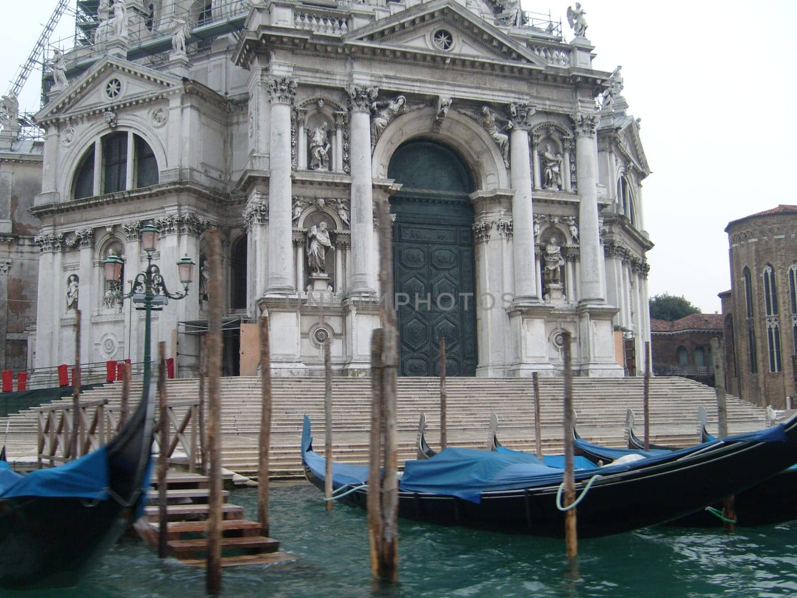 Venice, Italy, July 22, 2007. Venetian streets with graceful building facades. Grand Canal. Along the canal are Gothic and Renaissance palaces. Sights of Italy. Tourism business