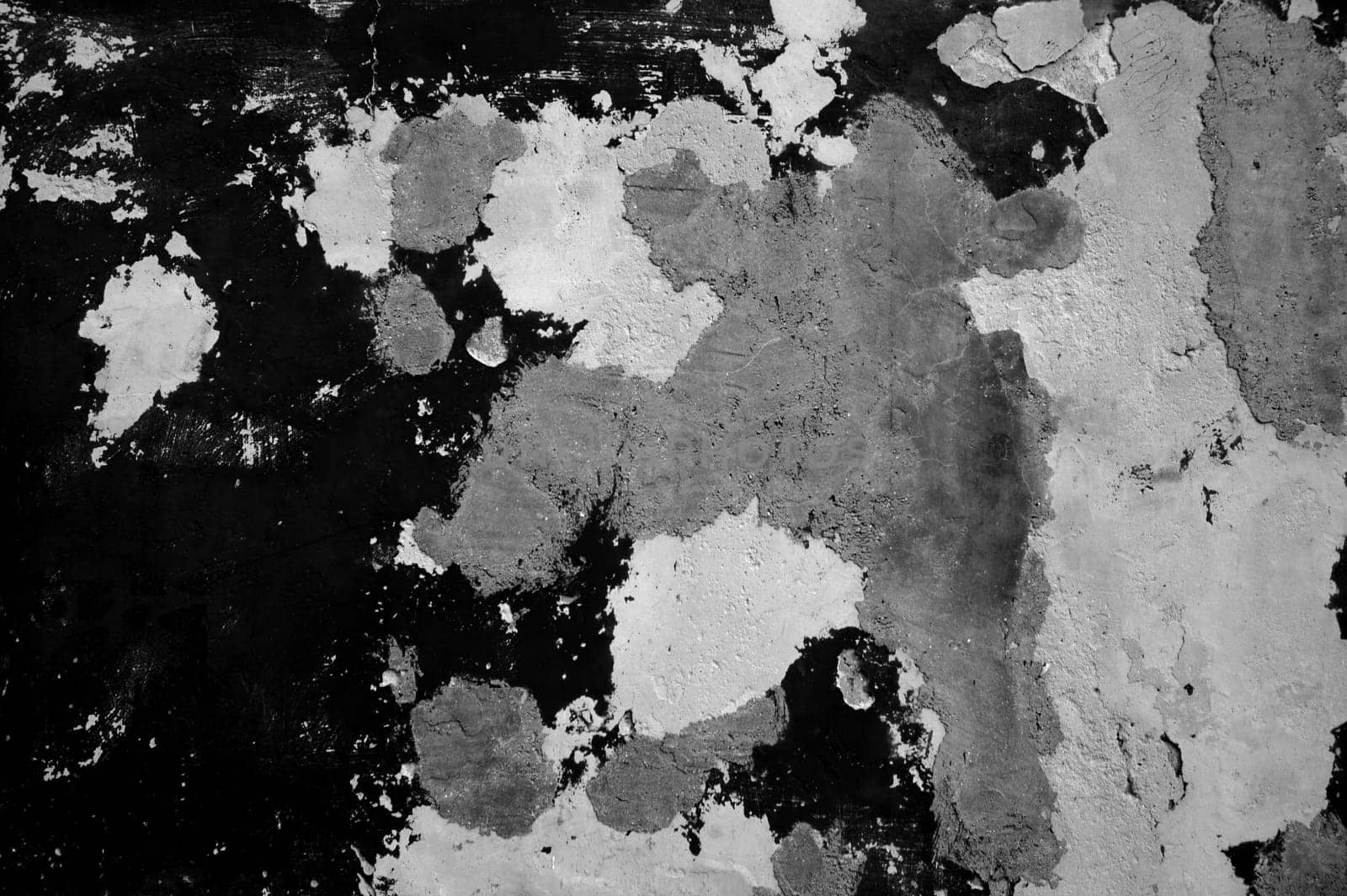 Very old distressed wall with weathered black, grey white color