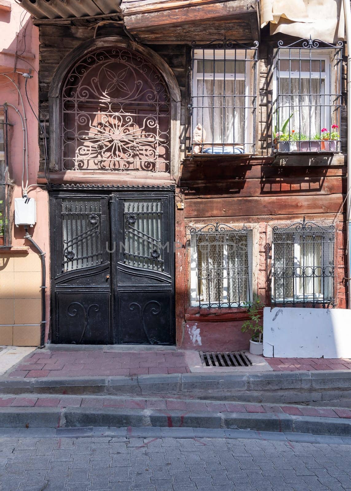 Beautiful old traditional wooden and stone houses in old Balat district, on a summer day, Istanbul, Turkey