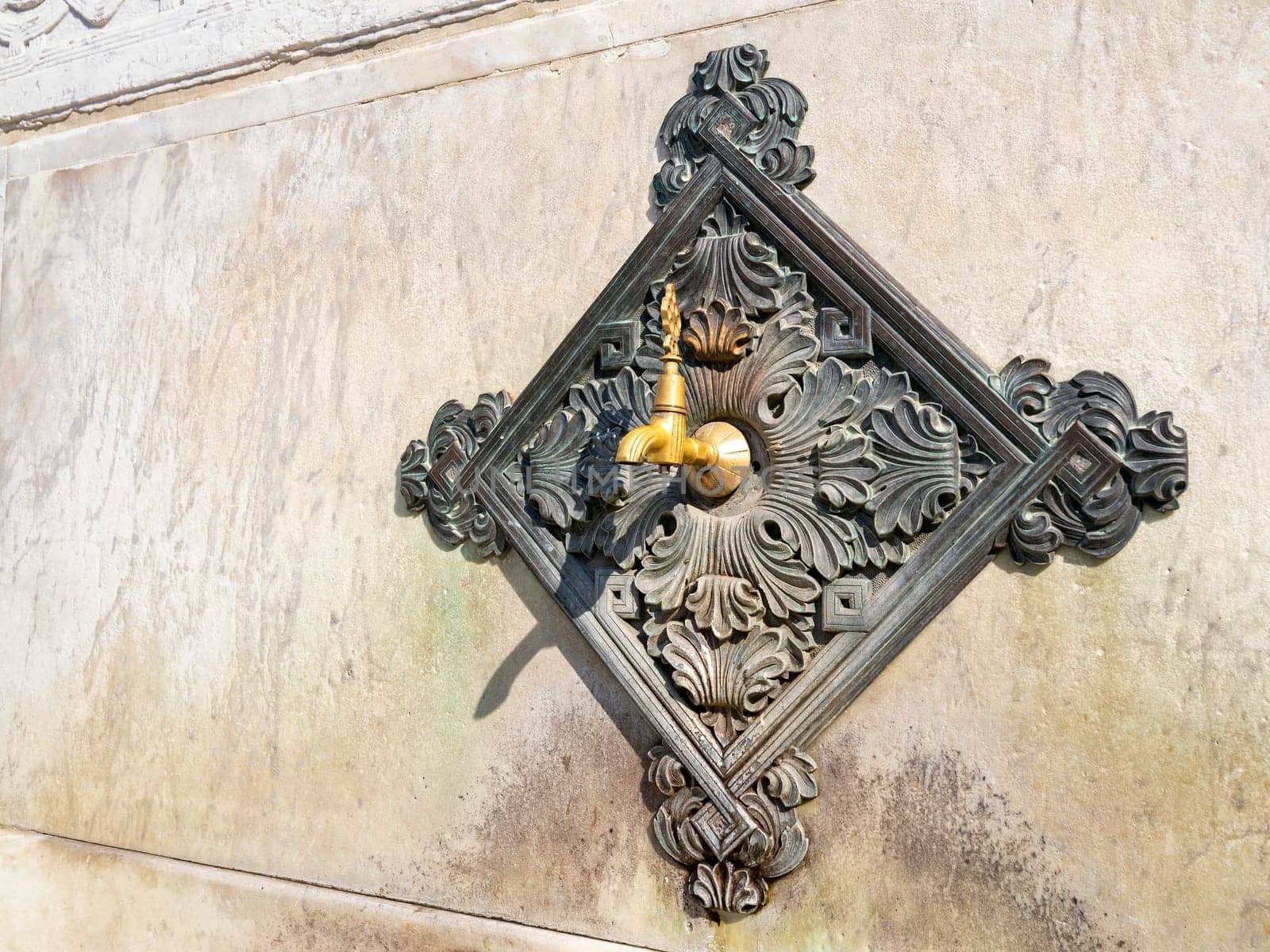 Turkish Ottoman style antique ablution tap at the German Fountain, or Alman Cesmesi, a gazebo styled fountain in the northern end of old hippodrome, or Sultanahmet Square, Istanbul, Turkey